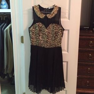 Black and gold sequin dress