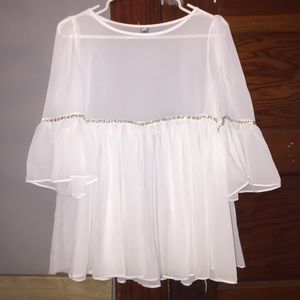 White ruffle blouse