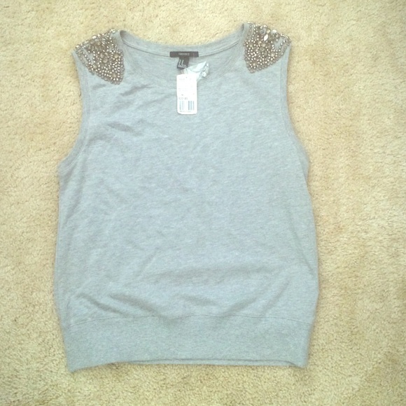 Gray top with jewelson shoulder . Never worn!