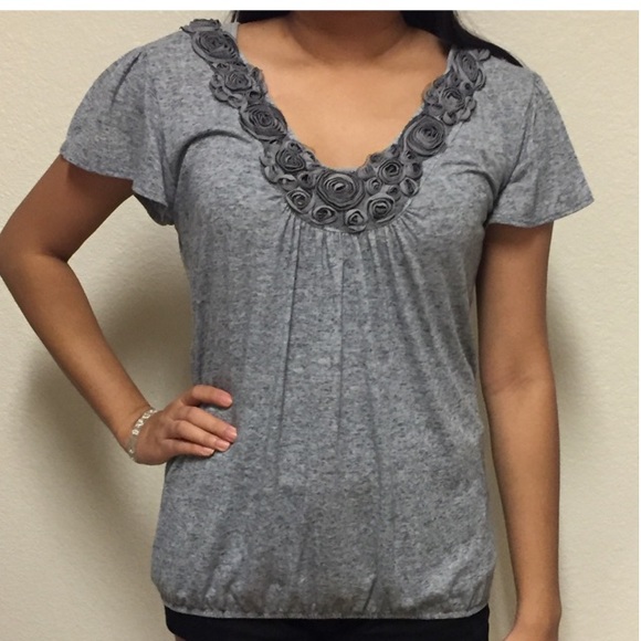 Grey top with flower accent