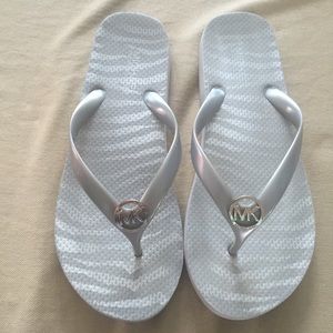 Micheal Kors grey flip flops