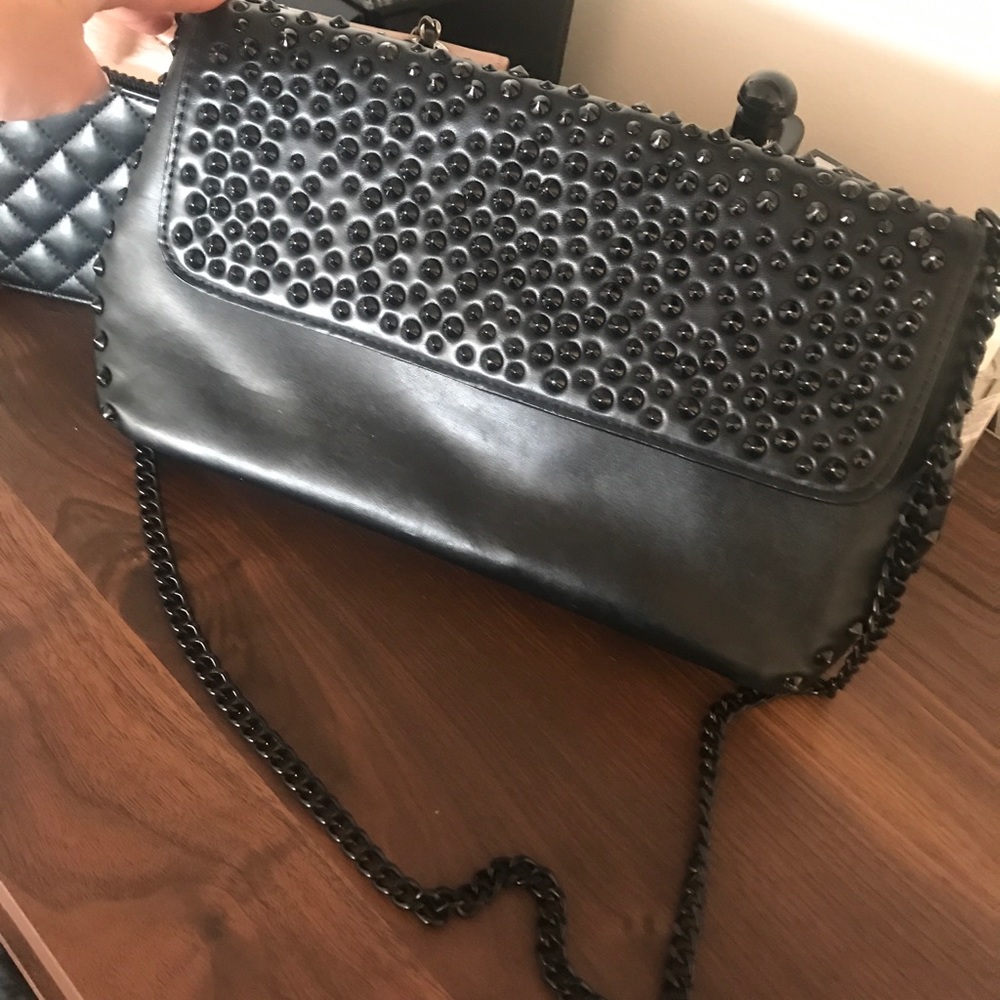 black shoulder bag with stud detail