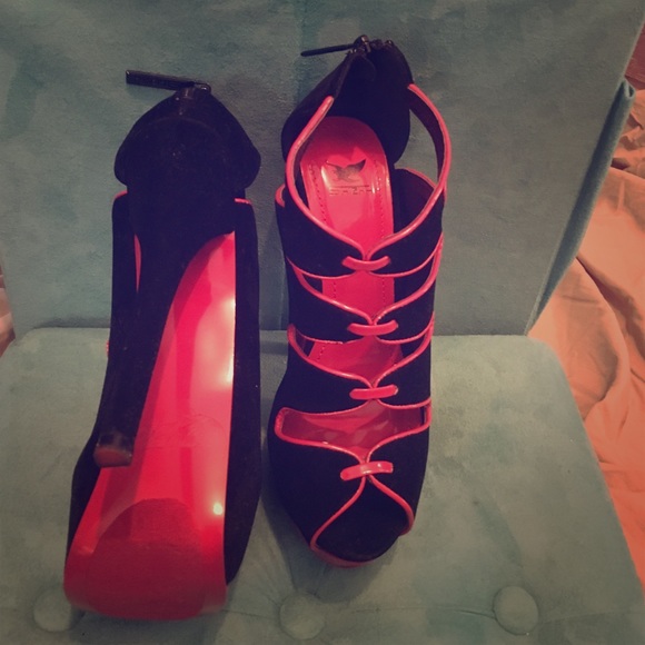 Red bottom suede platform pump heels.