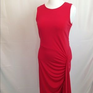 Red dress with unique hemline.