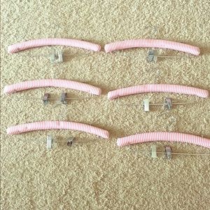 Pink and white striped clip hangers.