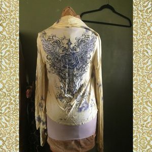 In good condition. Like a Tye dye cardigan.