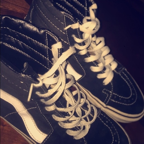 High top black & white vans .