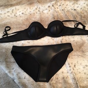 Triangl black leather swim suit.