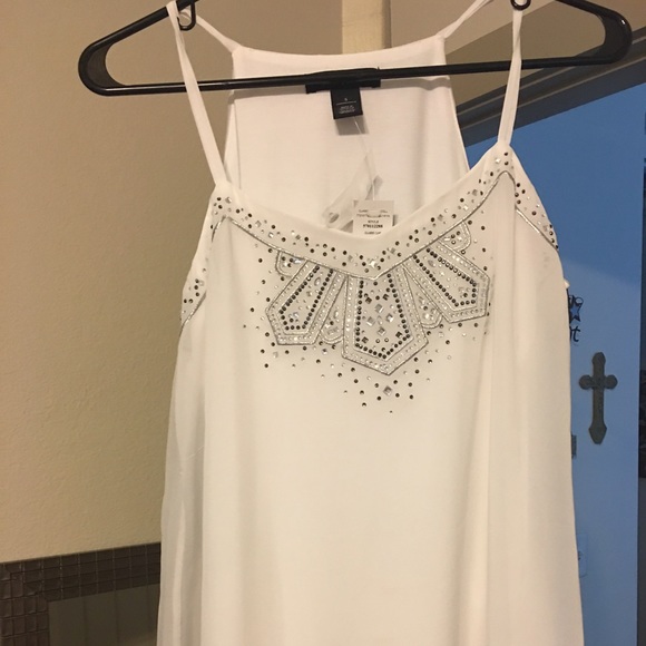 Beautiful white tank with jewels at the top!