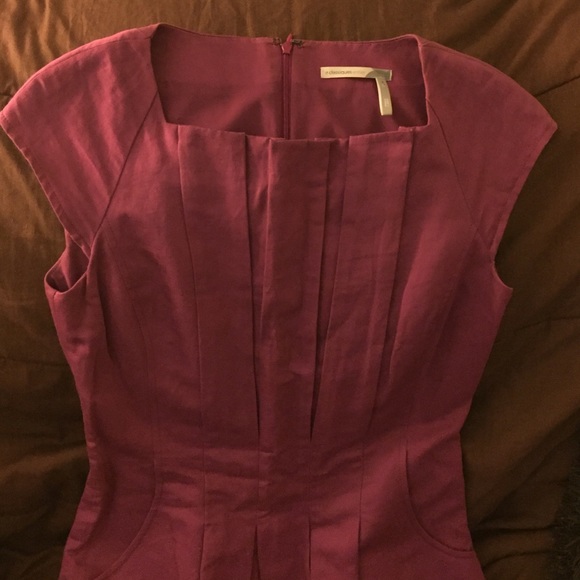 Pomegranate colored professional dress.
