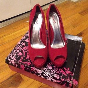 Red suede pumps