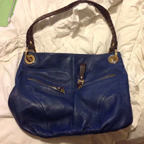 B. Makowsky leather blue bag with brown strap
