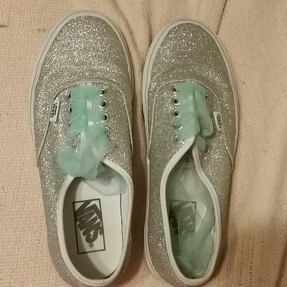 Silver sparkly vans with teal tull laces