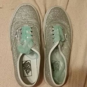 Silver sparkly vans with teal tull laces