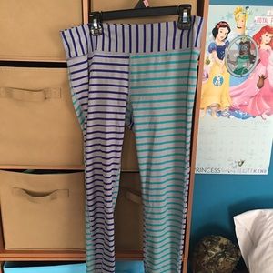 blue and purple striped workout leggings.
