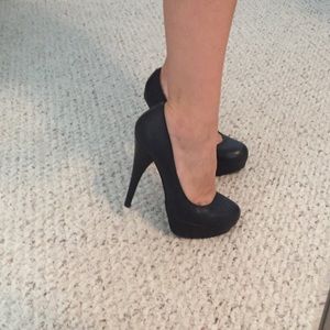 Black leather pumps