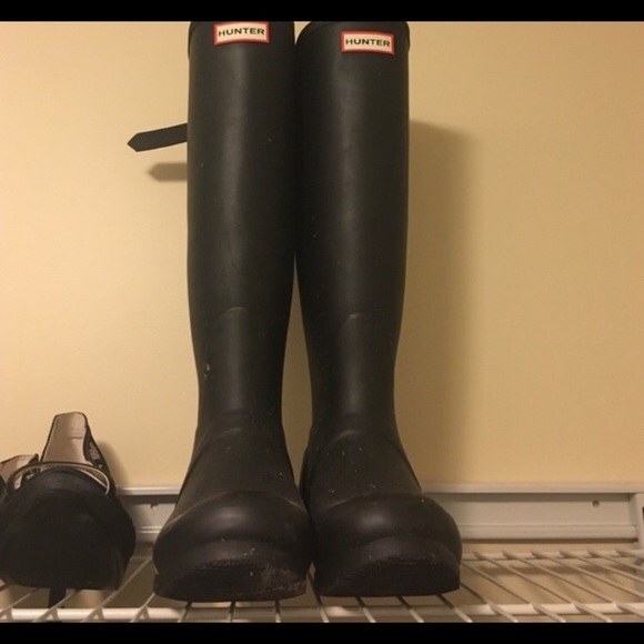 Black tall hunter boots