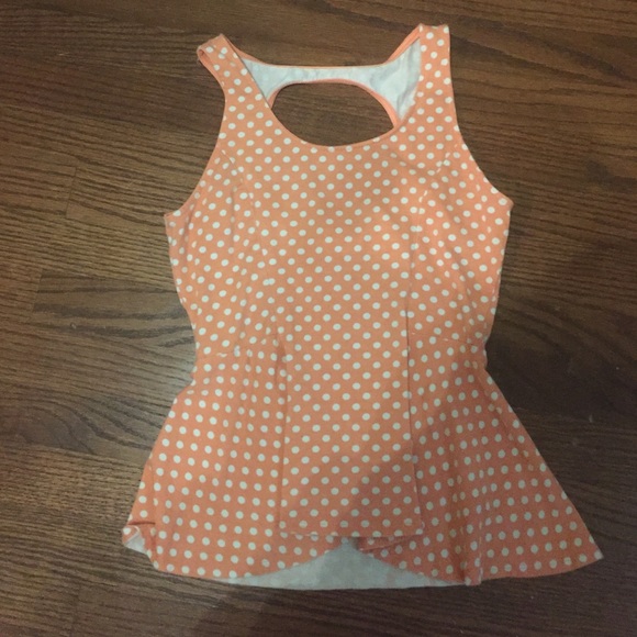 Open back ruffle bottom shirt
