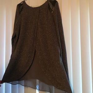 Split back with sheer inlay, shimmery sweater.