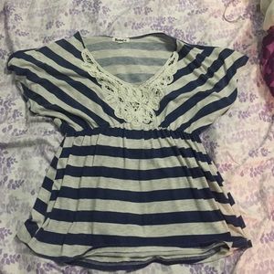 Blue and gray striped blouse.