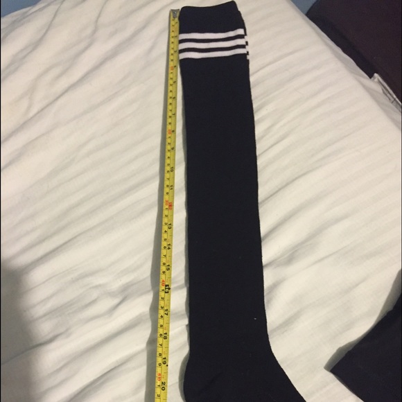 Long black socks with white stripes