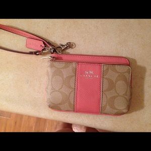 Pink and tan Coach wristlet wallet