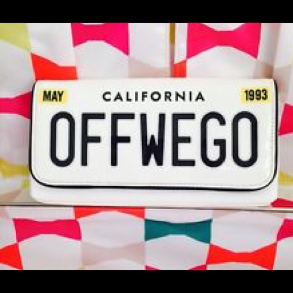 kate spade Handbags - NWT Kate Spade Off We Go License Plate Clutch FLAW