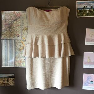 Strapless shimmery off white peplum dress