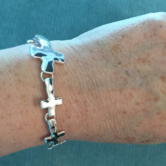 Silver cross bracelet. Never worn
