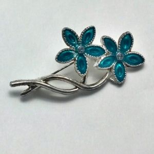 Silver tone blue flower brooch
