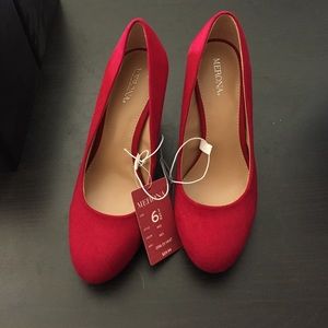 Red faux suede pumps