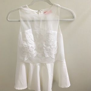 White peplum blouse with embellished front detail