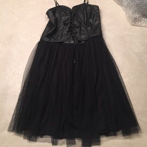 Black faux leather lace-up corset dress.