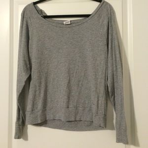 Light grey, long sleeved PINK top.