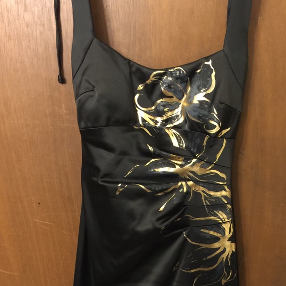 Black and gold halter dress flowers on side