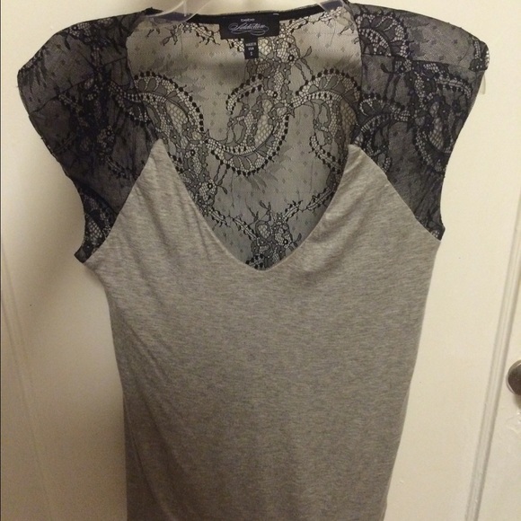 Bebe long shirt. Back is see thru. NEVER WORN