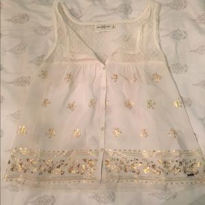 Sheer flowing tank with gold leaf accents