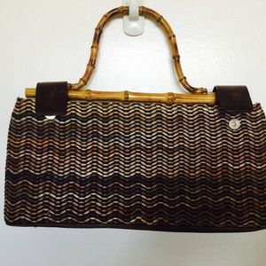 Gorgeous summer straw purse, with bamboo handle.
