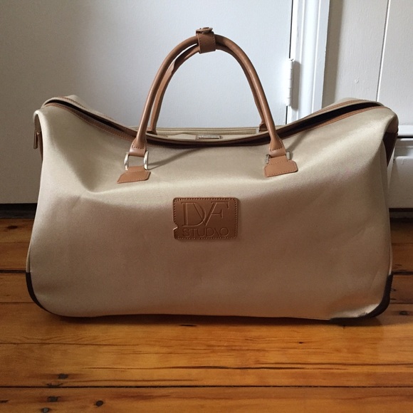 DVF Studio luggage NWOT. In perfect condition