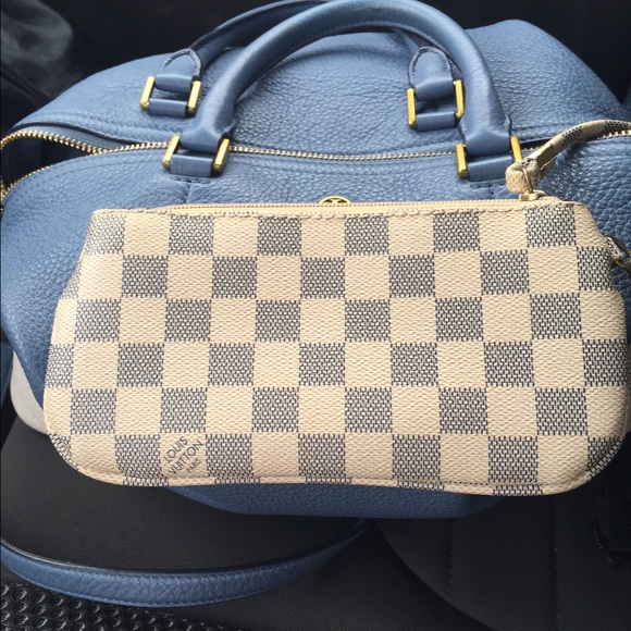 Louis Vuitton wristlet.