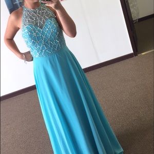 Hello, I am selling a light blue prom dress.