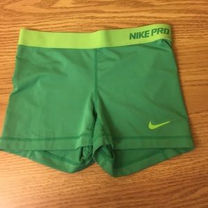 Green Nike Pro workout shorts