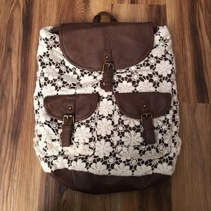 Claire's floral crochet overlay backpack