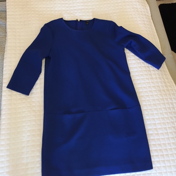 Size 8. Blue mini dress with pockets