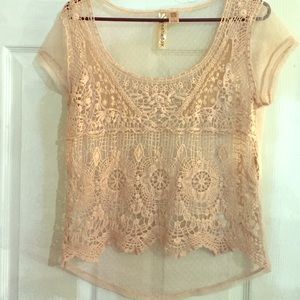 Tan lace shirt. Back is tan but see through.