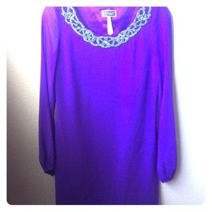 Dress with sheer sleeves and detail on neckline