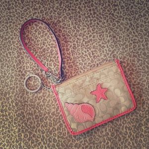 Coach coral & tan wristlet with cute ocean theme!