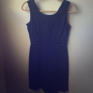 Black dress with button detail. Vs in the back