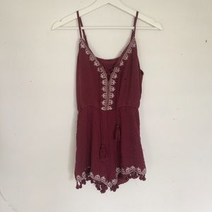 Burgundy Lace Up Romper with Tassel Detail