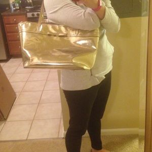 Oversized gold Kate spade tote with spot design